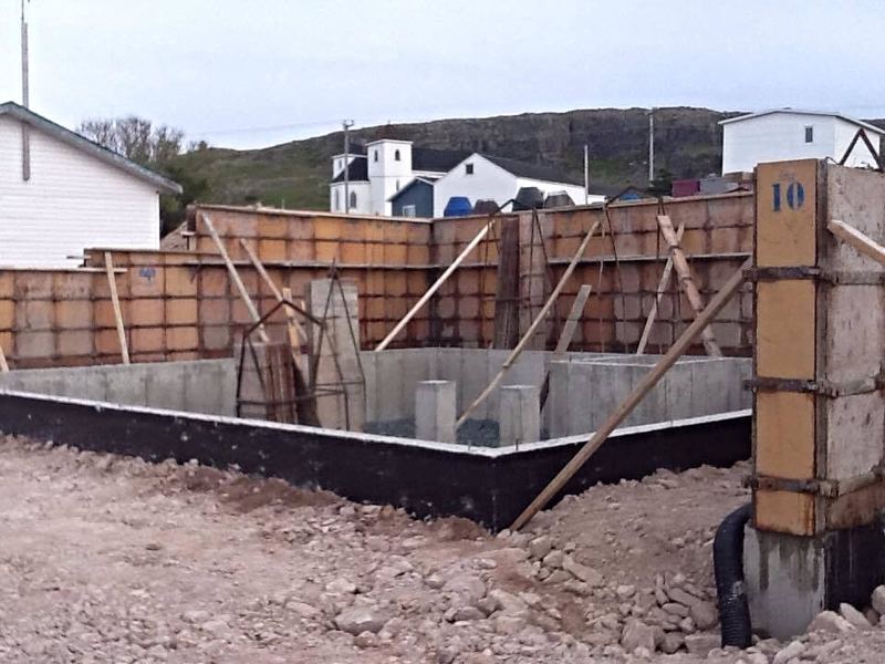 Residential foundation with a retaining wall, forms in place